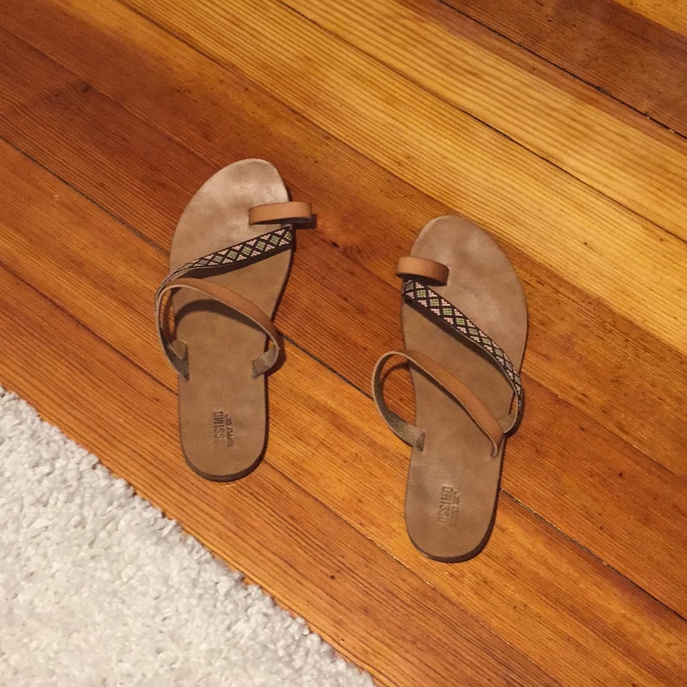 Tan strappy sandal with embroidered detail.